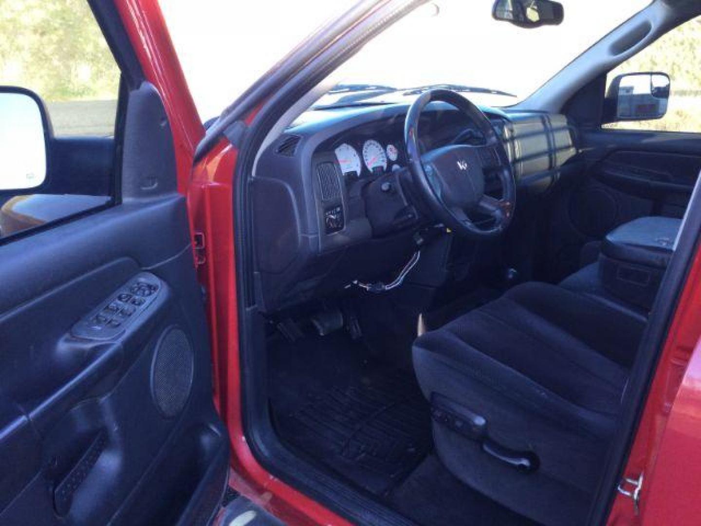 2004 Flame Red /Dark Slate Gray Cloth Interior Dodge Ram 2500 SLT Quad Cab Long Bed 4WD (3D7KU28C84G) with an 5.9L L6 OHV 24V TURBO DIESEL engine, 4-Speed Automatic transmission, located at 1801 Main Street, Lewiston, 83501, (208) 743-9371, 46.417065, -117.004799 - Photo#4