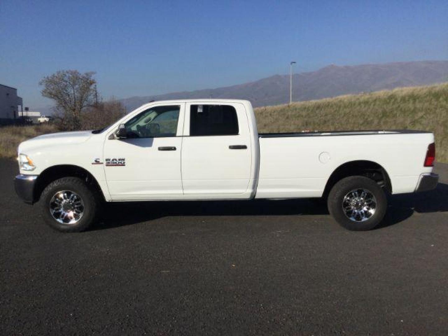 2018 Bright White Clear Coat /Black/Diesel Gray, cloth RAM 3500 Tradesman Crew Cab 4WD (3C63R3GL4JG) with an 6.7L L6 OHV 24V TURBO DIESEL engine, 6-Speed Manual Transmission transmission, located at 1801 Main Street, Lewiston, 83501, (208) 743-9371, 46.417065, -117.004799 - Photo#1