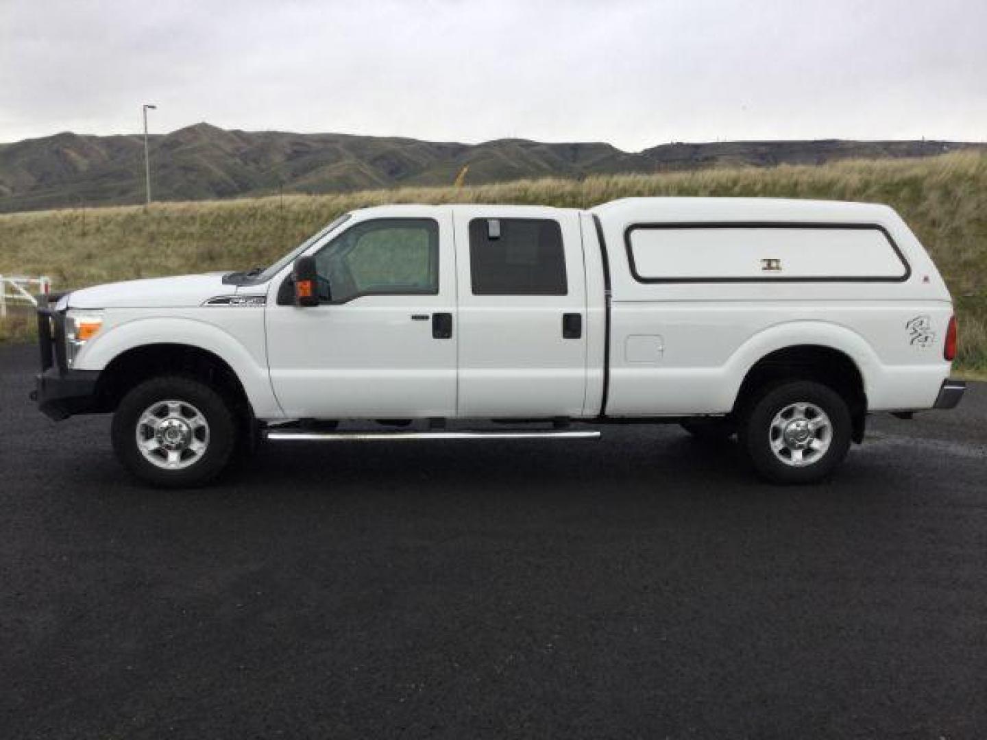 2015 Oxford White /Steel Ford F-350 SD XLT Crew Cab Long Bed 4WD (1FT7W3BTXFE) with an 6.7L V8 OHV 16V DIESEL engine, 6-Speed Automatic transmission, located at 1801 Main Street, Lewiston, 83501, (208) 743-9371, 46.417065, -117.004799 - Photo#1