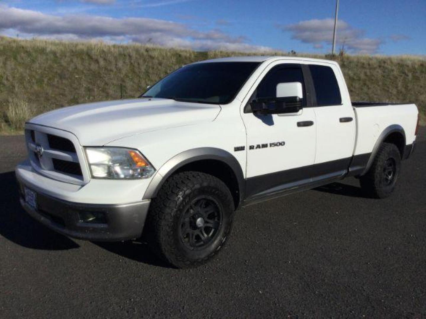 2012 Bright White/Mineral Gray Metallic /Dark Slate/Medium Graystone Cloth Interior RAM 1500 SLT Quad Cab 4WD (1C6RD7GT0CS) with an 5.7L V8 OHV 16V engine, 5-Speed Automatic transmission, located at 1801 Main Street, Lewiston, 83501, (208) 743-9371, 46.417065, -117.004799 - Photo#0