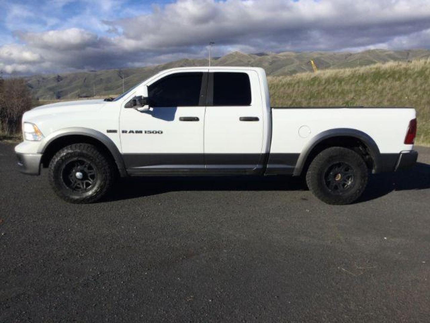 2012 Bright White/Mineral Gray Metallic /Dark Slate/Medium Graystone Cloth Interior RAM 1500 SLT Quad Cab 4WD (1C6RD7GT0CS) with an 5.7L V8 OHV 16V engine, 5-Speed Automatic transmission, located at 1801 Main Street, Lewiston, 83501, (208) 743-9371, 46.417065, -117.004799 - Photo#1