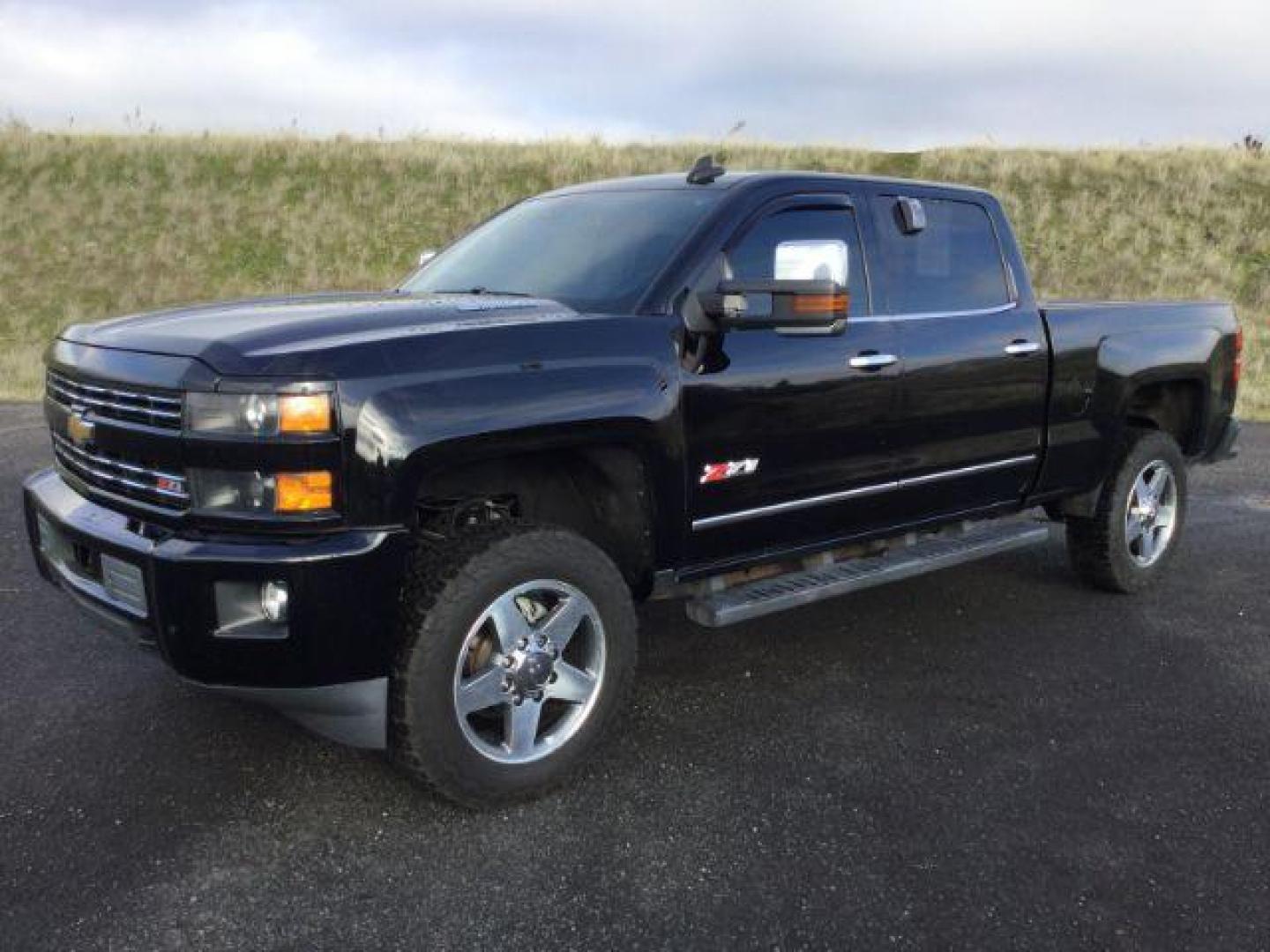 2015 Black /Jet Black Chevrolet Silverado 2500HD LTZ Crew Cab 4WD (1GC1KWE83FF) with an 6.6L V8 OHV 32V TURBO DIESEL engine, 6-Speed Automatic transmission, located at 1801 Main Street, Lewiston, 83501, (208) 743-9371, 46.417065, -117.004799 - Photo#0