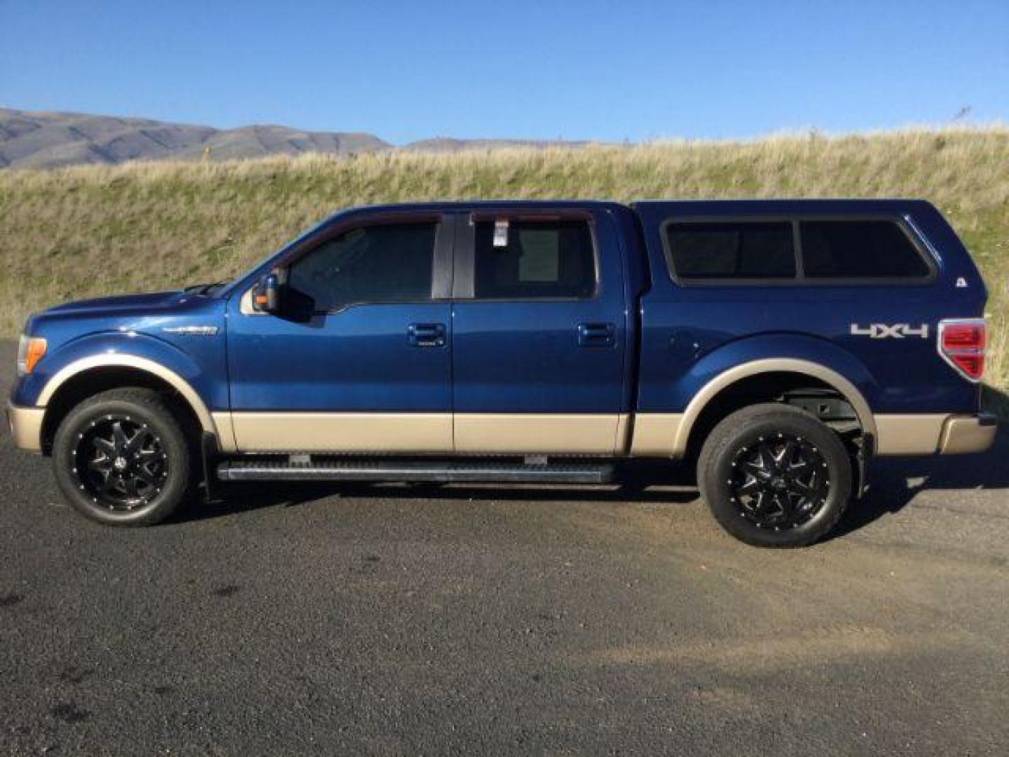 2011 Blue/Gold /Black Leather Interior Ford F-150 Lariat SuperCrew 5.5-ft. Bed 4WD (1FTFW1EF3BF) with an 5.0L V8 engine, 6-SPEED AUTOMATIC transmission, located at 1801 Main Street, Lewiston, 83501, (208) 743-9371, 46.417065, -117.004799 - Photo#1