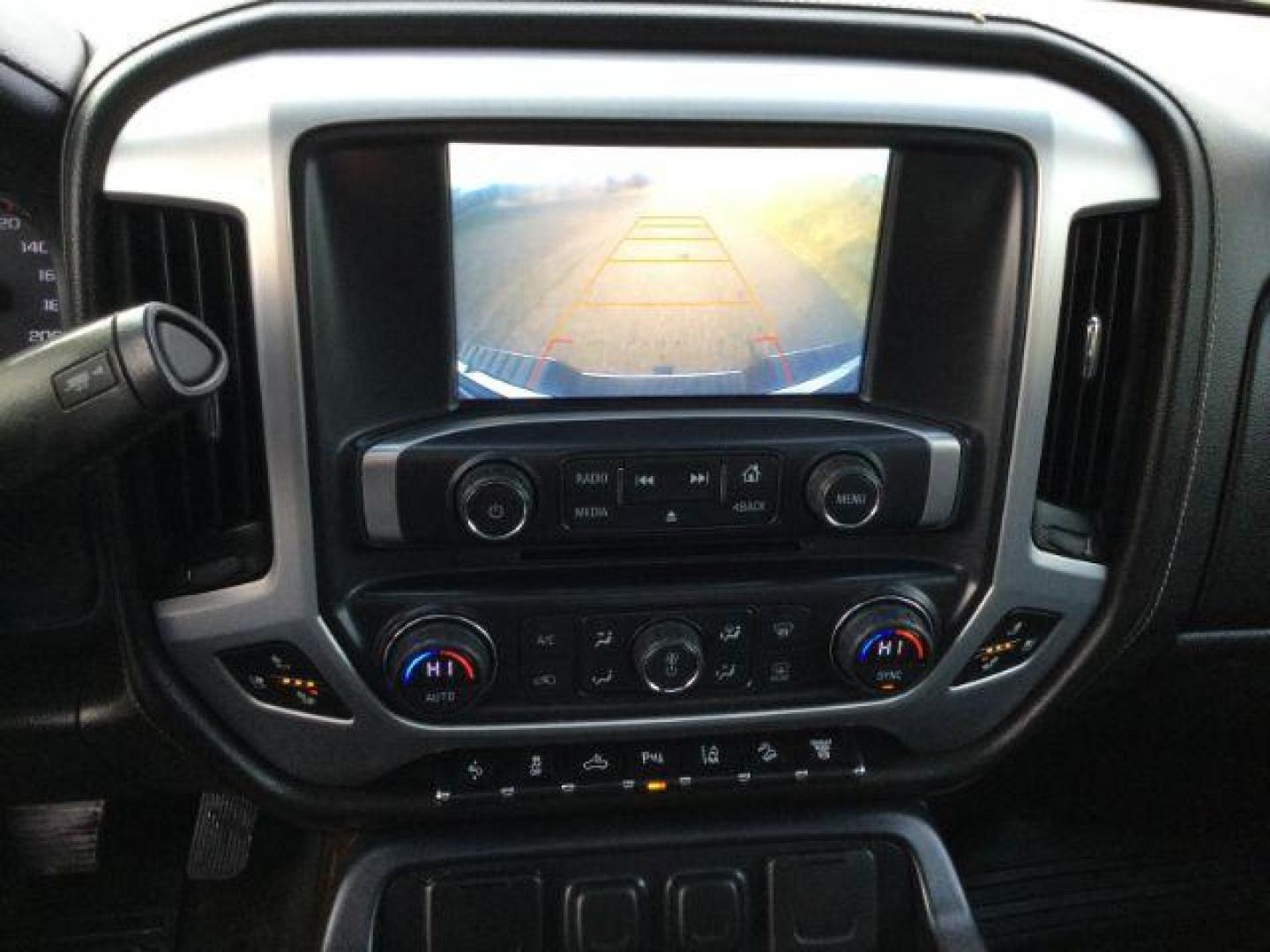 2016 Onyx Black /Jet Black, leather GMC Sierra 3500HD SLT Crew Cab 4WD (1GT42XE82GF) with an 6.6L V8 OHV 16 DIESEL engine, 6-Speed Automatic transmission, located at 1801 Main Street, Lewiston, 83501, (208) 743-9371, 46.417065, -117.004799 - Photo#16