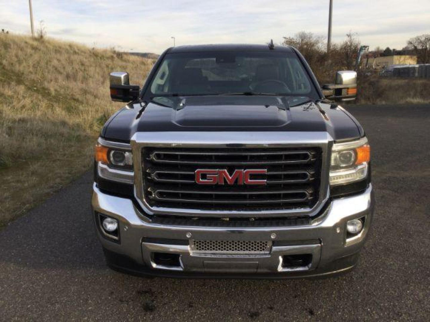 2016 Onyx Black /Jet Black, leather GMC Sierra 3500HD SLT Crew Cab 4WD (1GT42XE82GF) with an 6.6L V8 OHV 16 DIESEL engine, 6-Speed Automatic transmission, located at 1801 Main Street, Lewiston, 83501, (208) 743-9371, 46.417065, -117.004799 - Photo#8