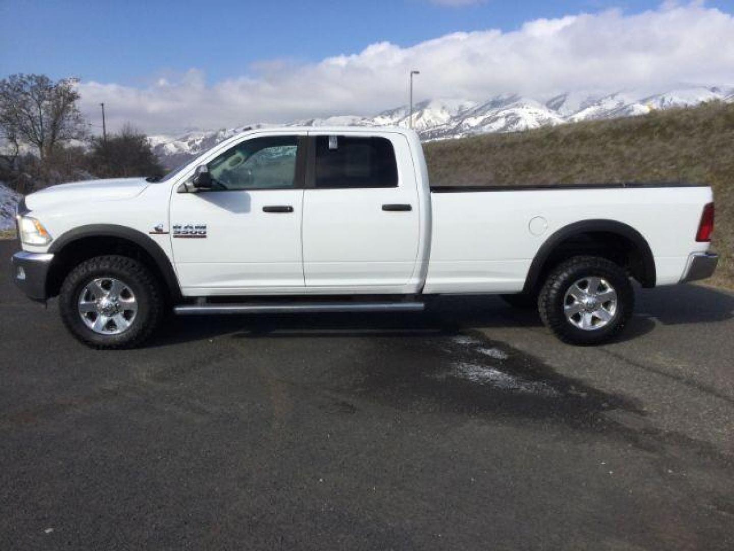 2014 Bright White Clearcoat /Diesel Gray/Black Ram 3500 SLT Crew Cab LWB 4WD (3C63R3HL6EG) with an 6.7L I6 T-Diesel engine, 6-Speed Automatic transmission, located at 1801 Main Street, Lewiston, 83501, (208) 743-9371, 46.417065, -117.004799 - Photo#1