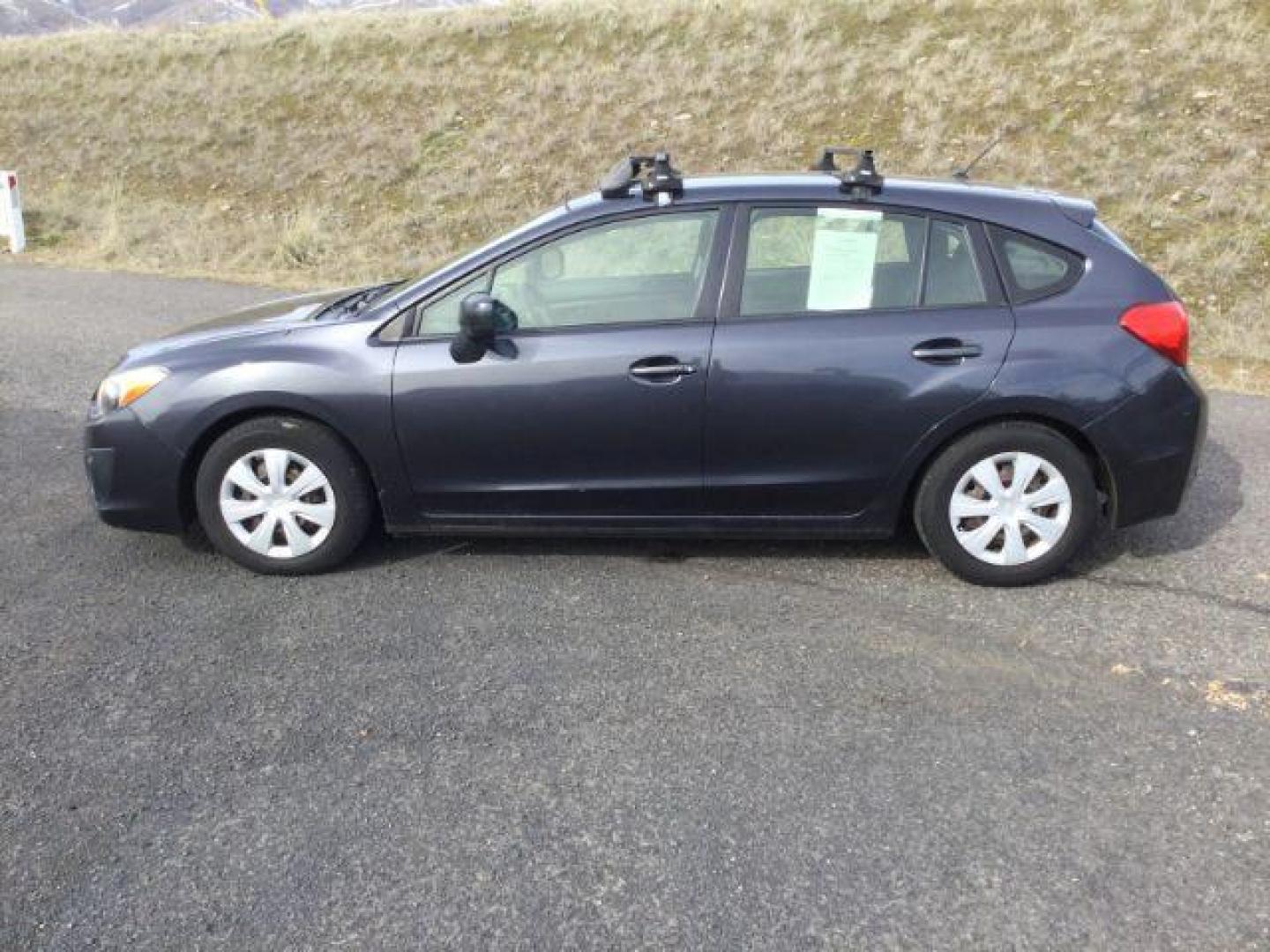 2013 Dark Gray Metallic Subaru Impreza 2.0i (JF1GPAA63D2) with an 2L H-4 DOHC engine, located at 1801 Main Street, Lewiston, 83501, (208) 743-9371, 46.417065, -117.004799 - Photo#1