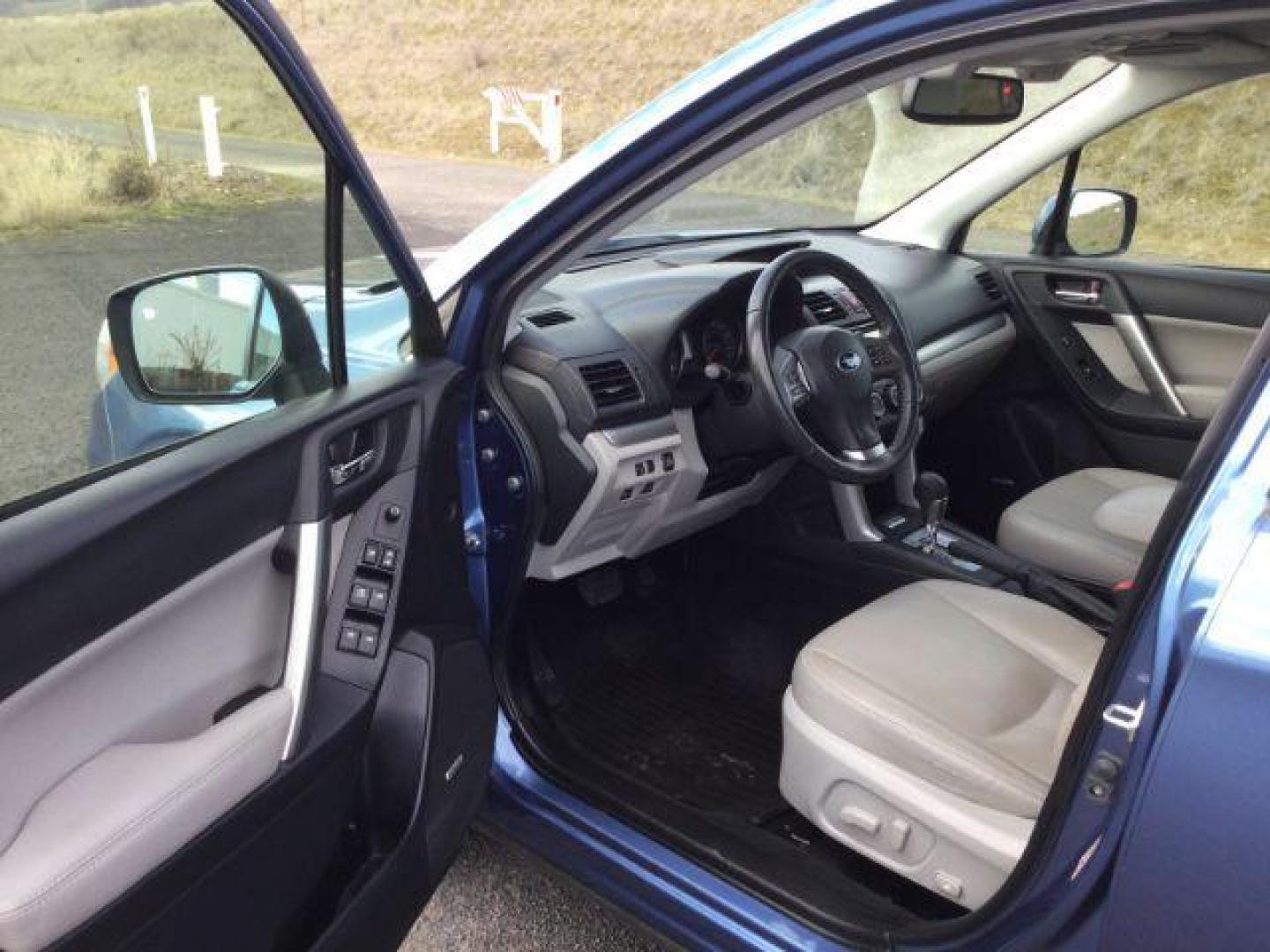 2015 Quartz Blue Pearl Subaru Forester 2.5i Limited (JF2SJARC8FH) with an 2.5L H-4 DOHC engine, located at 1801 Main Street, Lewiston, 83501, (208) 743-9371, 46.417065, -117.004799 - Photo#3